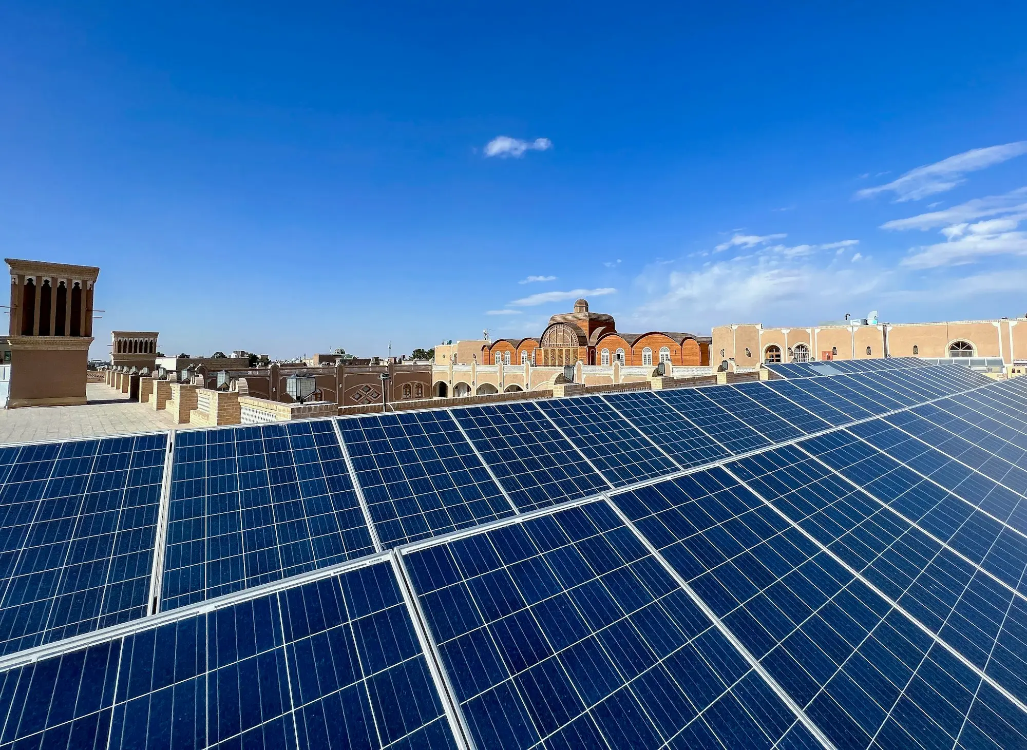 Solar panels installed across the roof of a commercial building